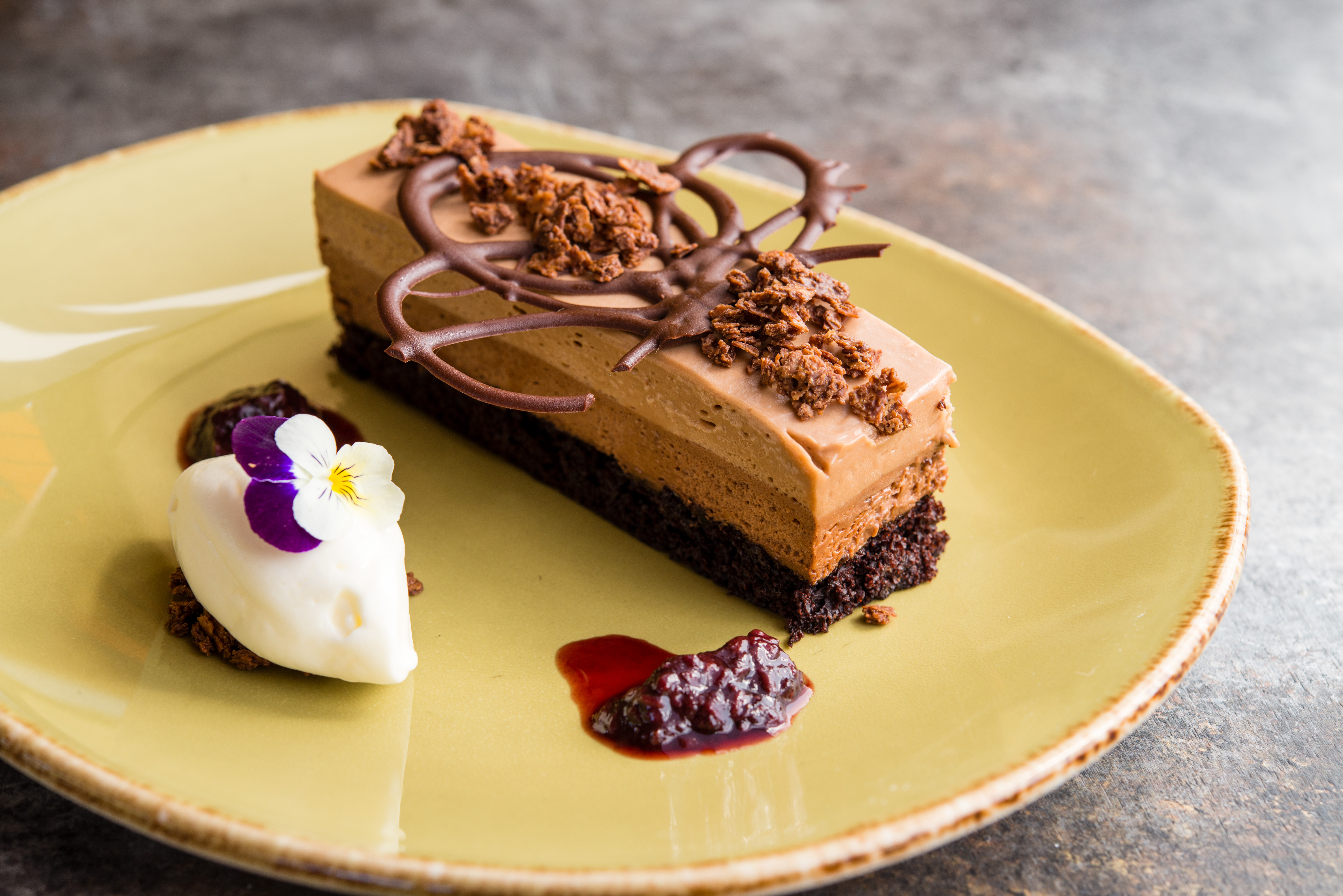 Try the Triple Chocolate Mousse Cake (berries chocolate tuile) for the ultimate sweet treat.